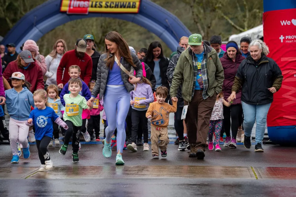 Parents running the fun run with their kids