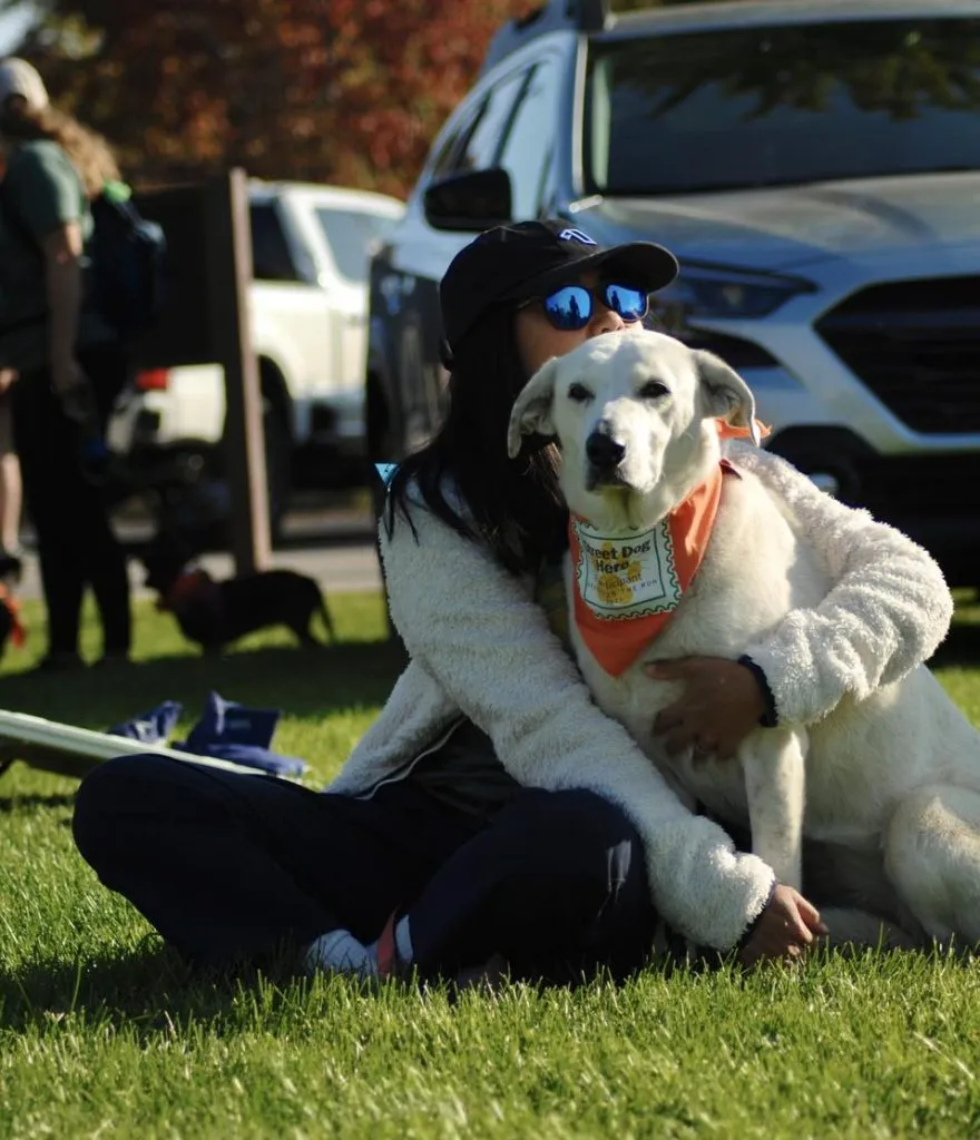 A woman hugging a dog
